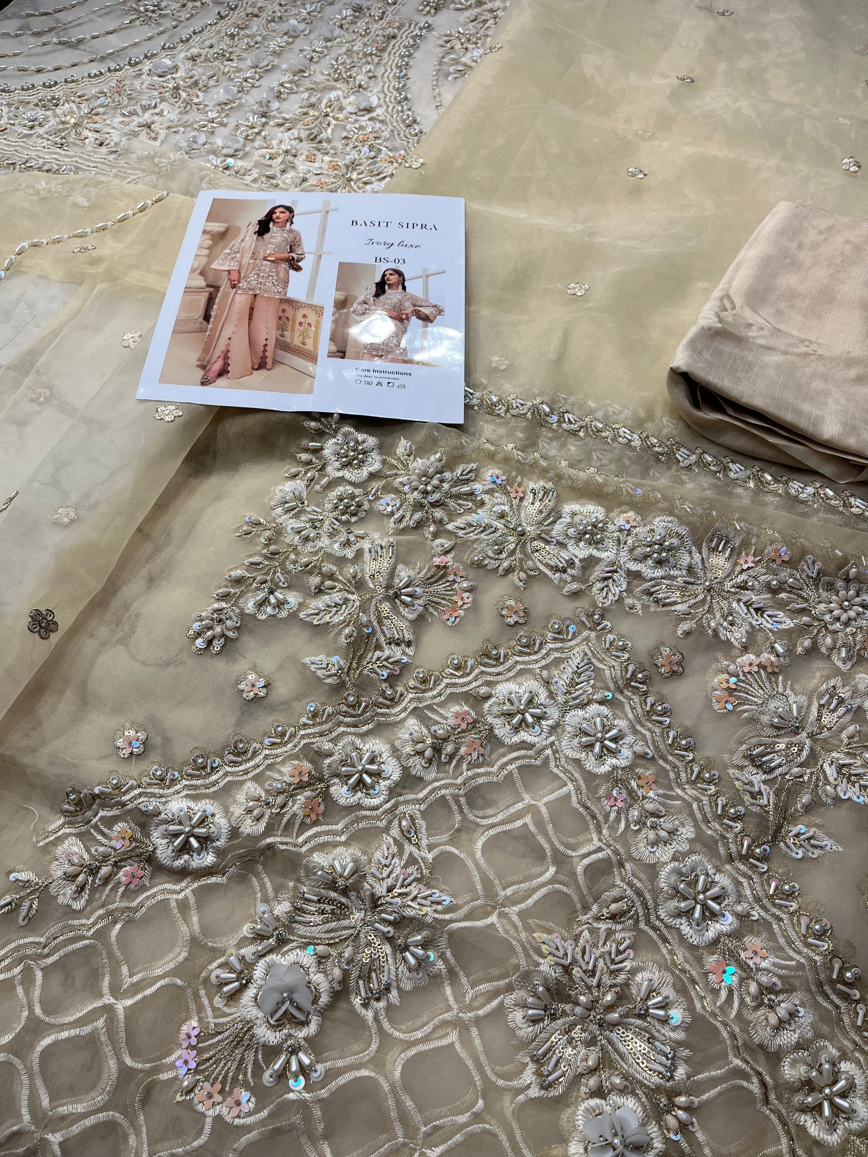 Ivory Luxe pakistani fashion outfit in ivory, beige, gold tones.
